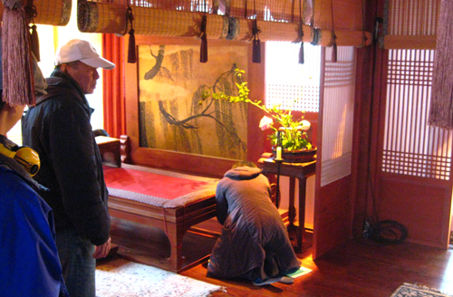 Hou-overseeing-details-on-set-500.jpg
